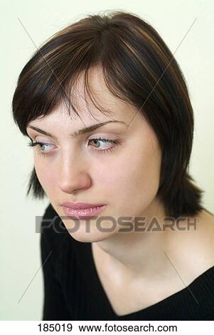 Young woman with short brown hair looking away View Large Photo Image Stock Photo - Young woman with short brown hair looking away. Fotosearch