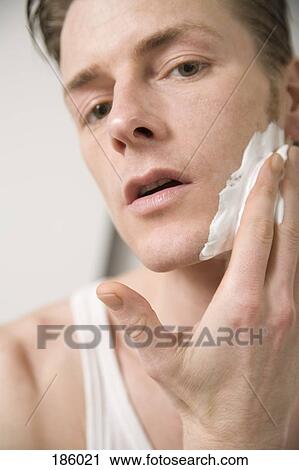 Man applying shaving cream View Large Photo Image Stock Image - Man applying shaving cream. Fotosearch