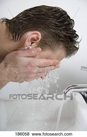 Man rinsing his face after shaving View Large Photo Image Stock Photo - Man rinsing his face after shaving. Fotosearch