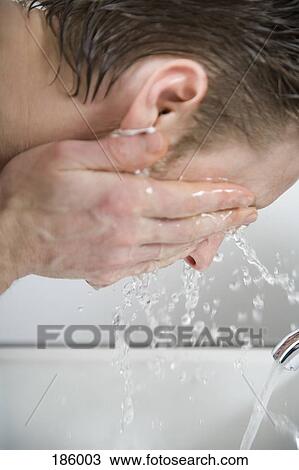 Man splashing water on his face after shaving View Large Photo Image Stock Image - Man splashing water on his face after shaving. Fotosearch