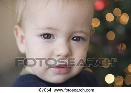 Baby boy near Christmas tree View Large Photo Image Picture - Baby boy near Christmas tree. Fotosearch