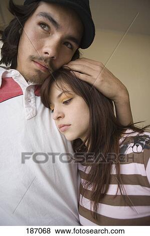 Teenage boy with arm around teenage girl View Large Photo Image Stock Photo - Teenage boy with arm around teenage girl. Fotosearch