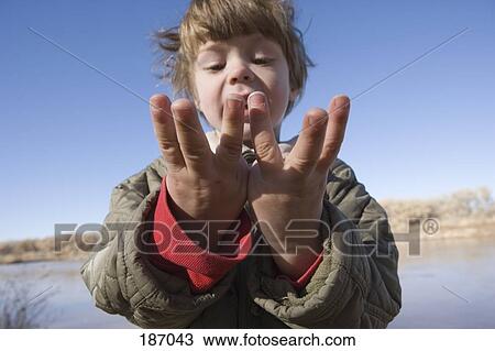 Young boy counting on his fingers View Large Photo Image Stock Image - Young boy counting on his fingers. Fotosearch