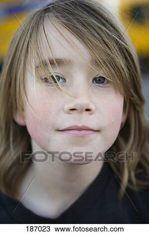 Young boy looking at camera View Large Photo Image Stock Image - Young boy looking at camera. Fotosearch
