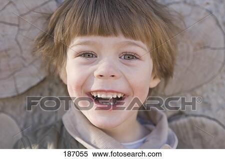 Young boy smiling View Large Photo Image Stock Photography - Young boy smiling. Fotosearch