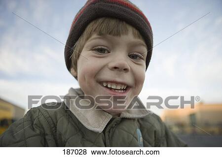 Young boy wearing hat View Large Photo Image Stock Photo - Young boy wearing hat. Fotosearch