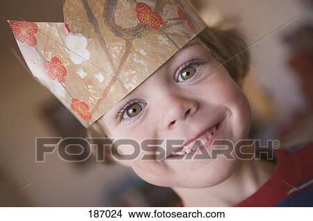 Young boy wearing paper crown View Large Photo Image Picture - Young boy wearing paper crown. Fotosearch