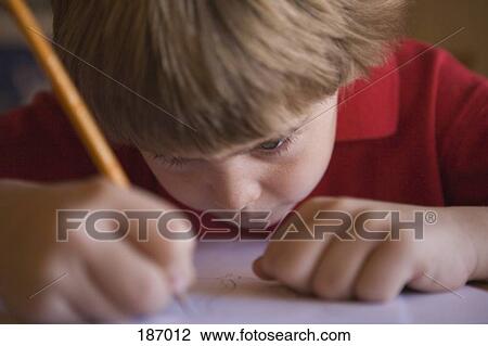Young boy writing View Large Photo Image Stock Image - Young boy writing. Fotosearch