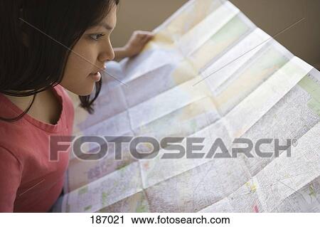 Young Native American woman holding map View Large Photo Image Stock Image - Young Native American woman holding map. Fotosearch