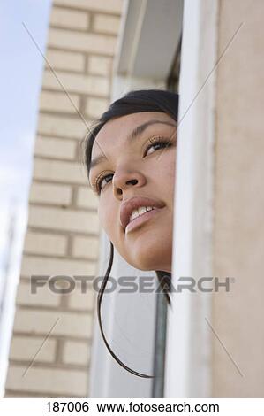Young Native American woman looking out door View Large Photo Image Stock Photograph - Young Native American woman looking out door. Fotosearch