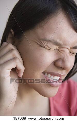 Young Native American Woman with ear ache View Large Photo Image Stock Photo - Young Native American Woman with ear ache. Fotosearch