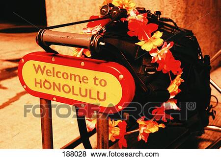 Luggage cart at Honolulu airport with welcome sign View Large Photo Image Stock Photo - Luggage cart at Honolulu airport with welcome sign. Fotosearch