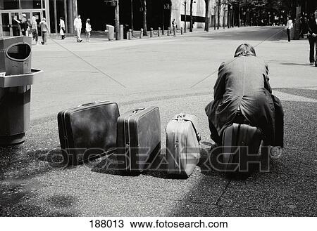 Man waiting on street corner with luggage View Large Photo Image Stock Image - Man waiting on street corner with luggage. Fotosearch