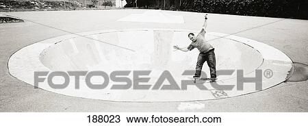 Two young men skateboarding at a skateboard park View Large Photo Image Stock Image - Two young men skateboarding at a skateboard park. Fotosearch