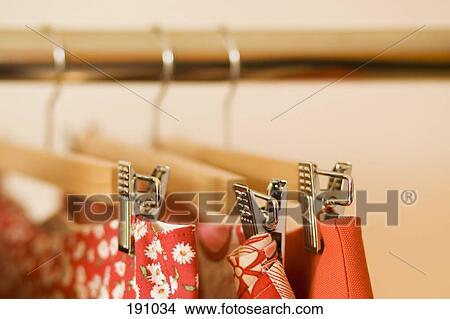 Close-up of skirts hanging on clothes rack View Large Photo Image Picture - Close-up of skirts hanging on clothes rack. Fotosearch