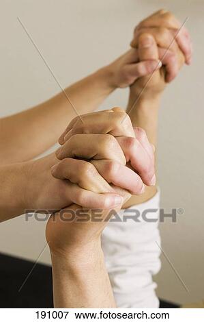 Entwined hands View Large Photo Image Stock Photo - Entwined hands. Fotosearch