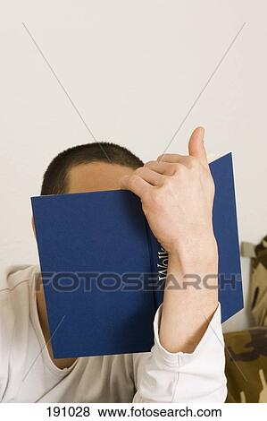 Stock Photo - Man reading book. Fotosearch