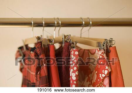 Skirts hanging on clothes rack View Large Photo Image Stock Photograph - Skirts hanging on clothes rack. Fotosearch