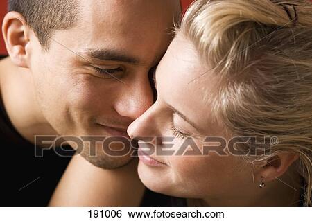 Stock Photograph - Young couple face to face. Fotosearch