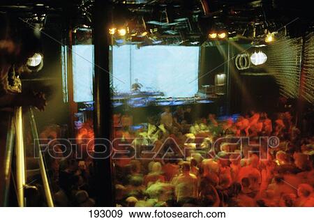 DJ playing music for crowd at nightclub View Large Photo Image Stock Photo - DJ playing music for crowd at nightclub. Fotosearch