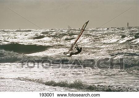 Person windsurfing on ocean View Large Photo Image Stock Image - Person windsurfing on ocean. Fotosearch