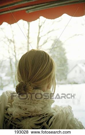 Young woman looking at view from veranda View Large Photo Image Stock Photo - Young woman looking at view from veranda. Fotosearch