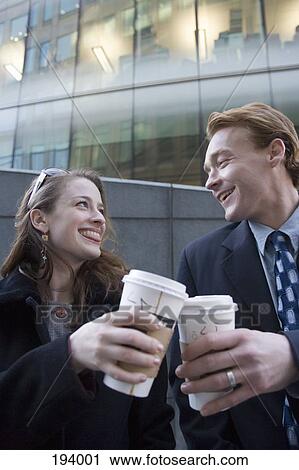 Businessman and businesswoman taking coffee break View Large Photo Image Stock Image - Businessman and businesswoman taking coffee break. Fotosearch