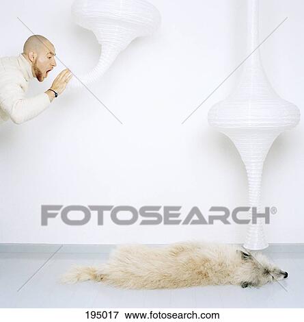 A man communicating with a dog View Large Photo Image Stock Photo - A man communicating with a dog. Fotosearch
