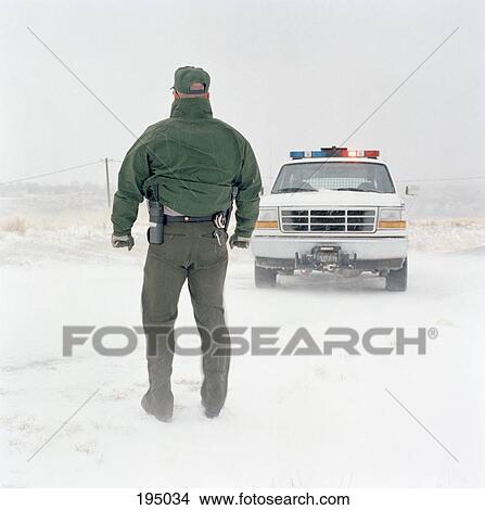 A park ranger from behind View Large Photo Image Picture - A park ranger from behind. Fotosearch