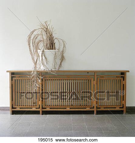 Stock Photography - A potted plant on a sideboard. Fotosearch
