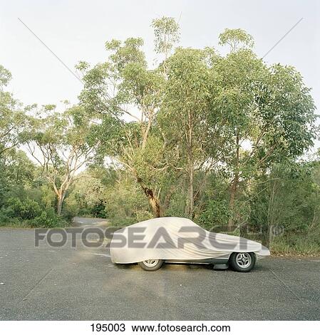 A sports car covered with a tarp View Large Photo Image Stock Image - A sports car covered with a tarp. Fotosearch