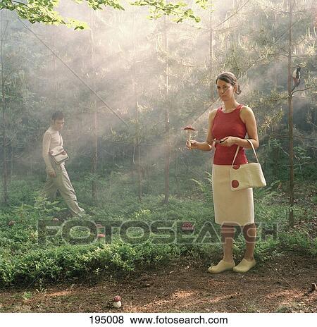 A woman posing with a mushroom and a knife in a forest View Large Photo Image Stock Photo - A woman posing with a mushroom and a knife in a forest. Fotosearch