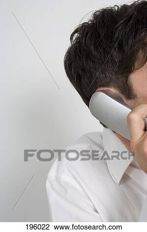 Stock Image - A man on the telephone. Fotosearch
