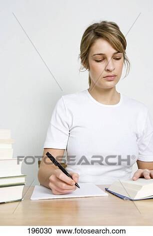 a woman reading and writing View Large Photo Image Stock Image - a woman reading and writing. Fotosearch