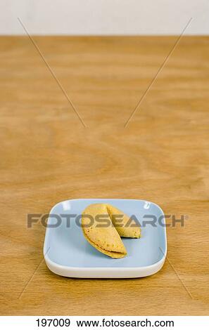 A fortune cookie in a dish View Large Photo Image Stock Photo - A fortune cookie in a dish. Fotosearch
