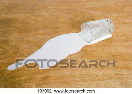 A glass of spilled milk View Large Photo Image Stock Image - A glass of spilled milk. Fotosearch