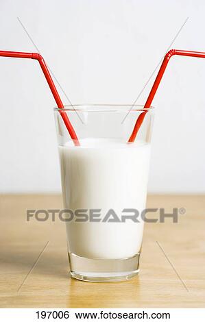 Two red straws in a glass of milk View Large Photo Image Stock Photograph - Two red straws in a glass of milk. Fotosearch