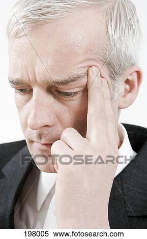 A businessman contemplating View Large Photo Image Stock Photography - A businessman contemplating. Fotosearch