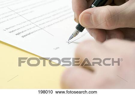 A man signing a contract View Large Photo Image Stock Image - A man signing a contract. Fotosearch