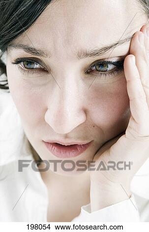 Picture - A woman with a tension headache. Fotosearch