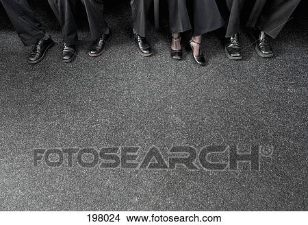 Four businesspeople wearing shoes View Large Photo Image Picture - Four businesspeople wearing shoes. Fotosearch