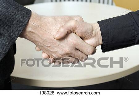 Two businessman shaking hands View Large Photo Image Stock Photograph - Two businessman shaking hands. Fotosearch