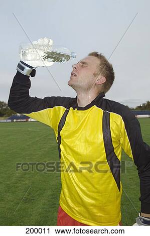 A goalie pouring water on his face View Large Photo Image Stock Image - A goalie pouring water on his face. Fotosearch
