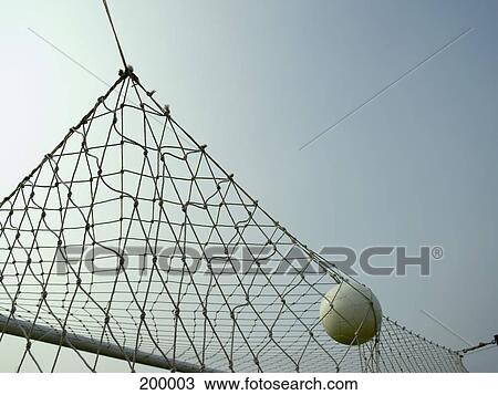 A soccer ball in a goal View Large Photo Image Stock Image - A soccer ball in a goal. Fotosearch