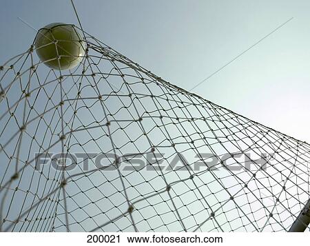 A soccer ball in a goal View Large Photo Image Stock Image - A soccer ball in a goal. Fotosearch