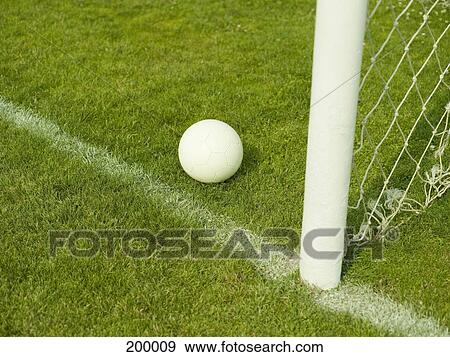 A soccer ball near a goal post View Large Photo Image Stock Photo - A soccer ball near a goal post. Fotosearch