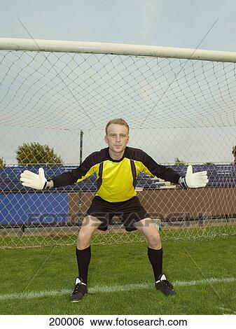 A soccer goalkeeper with his arms out to his sides View Large Photo Image Stock Photograph - A soccer goalkeeper with his arms out to his sides. Fotosearch