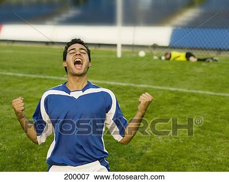 Stock Photo - A soccer player celebrating a goal. Fotosearch
