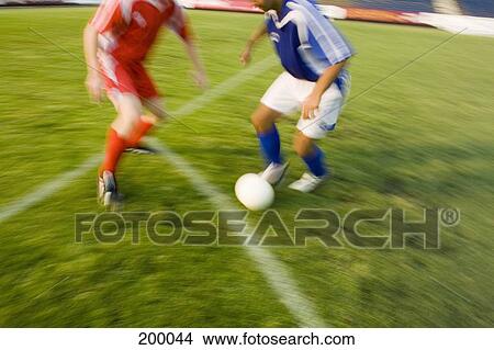 Two soccer players playing soccer View Large Photo Image Picture - Two soccer players playing soccer. Fotosearch