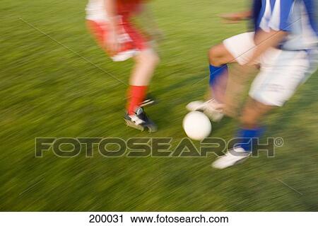Two soccer players playing soccer View Large Photo Image Stock Image - Two soccer players playing soccer. Fotosearch